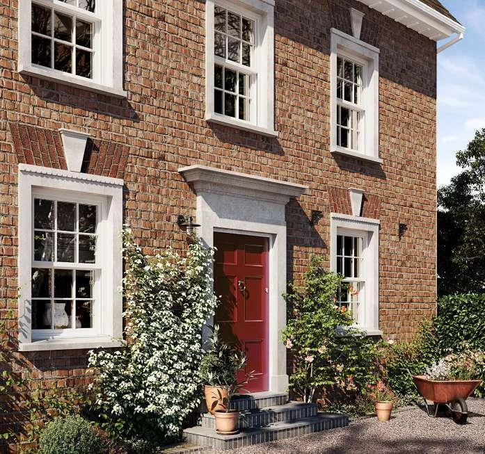 White sliding sash windows on a brick period home